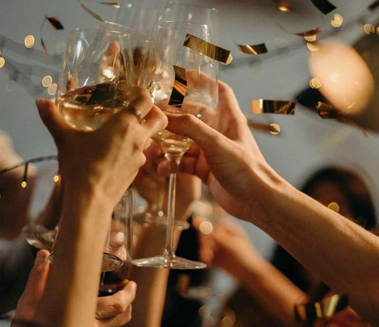 Friends raise their glasses to celebrate and welcome the new year.
